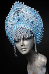 Woman mannequin head in blue decorated Russian kokoshnick