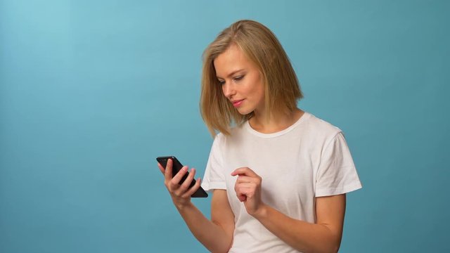 Female model swiping left on tinder profiles