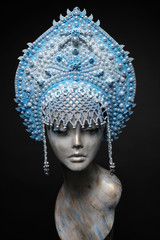 Woman mannequin head in blue decorated Russian kokoshnick