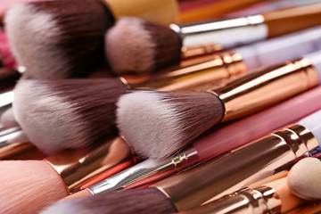 Set of makeup brushes on table, closeup