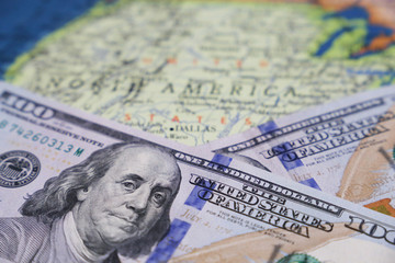 Dollar notes on the map of USA. Concept of american economy and finance, stock market, US policy