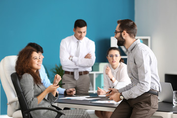 Young people having business meeting in office