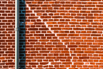 Abstract Red Brick Texture With Pipe