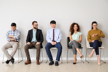 Young people waiting for job interview indoors