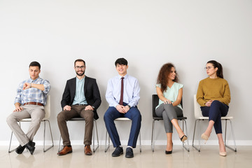Obraz premium Young people waiting for job interview indoors