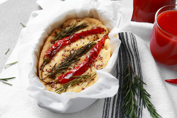 Baking dish with tasty Italian focaccia on table
