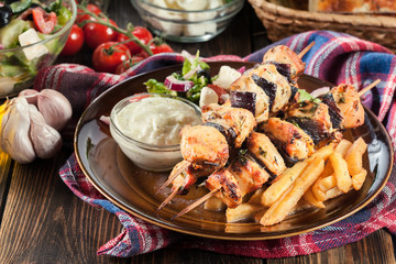 Chicken Souvlaki with french fries and tzatziki sauce