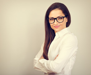 Beautiful business calm confident woman in eyeglasses looking on color background with empty copy space. Closeup