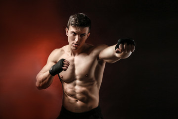 Attractive fighter on dark background