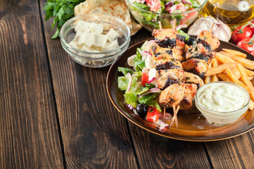 Chicken Souvlaki with french fries and tzatziki sauce