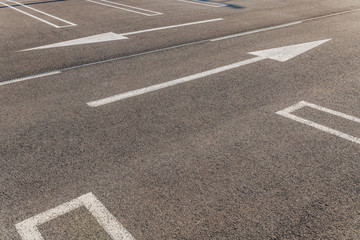 Picture of parking lot. Reserve space and arrows pointing left and right.