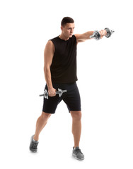 Sporty young man training with dumbbells against white background