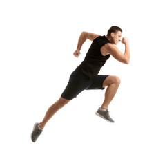 Sporty young man running against white background