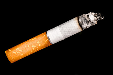 smoldering cigarette on a black background