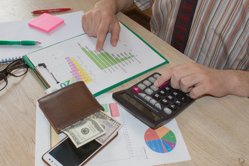 accounting and business concept. Businessman working on office desk. Home finances, investment, economy, saving money or insurance concept. Success, motivation, financial flows