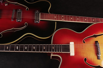Obraz na płótnie Canvas Two electric guitars on dark