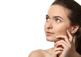 Young woman with beautiful eyebrows on white background