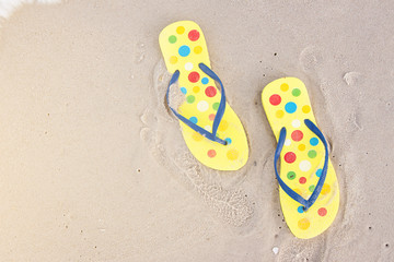 Flip flop on sand in holiday 