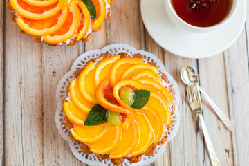 Jelly baked cake with jelly and fresh fruits, grapefruit, grapes and orange