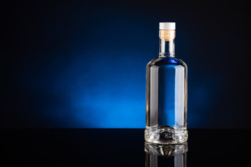 bottle of vodka on black background - obrazy, fototapety, plakaty