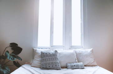 Interior Cozy bedroom in the morning and pillows.