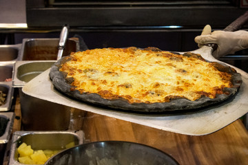 chef prepares delicious pizzas on the kitchen