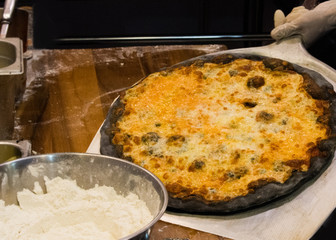 chef prepares delicious pizzas on the kitchen