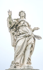 Fototapeta na wymiar Bernini statue of angel in Rome, famous turist place in Italy.