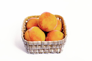 peaches with red sides on a light background