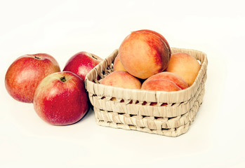 peaches with red sides on a light background