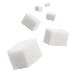 Falling sugar cubes, isolated on white background