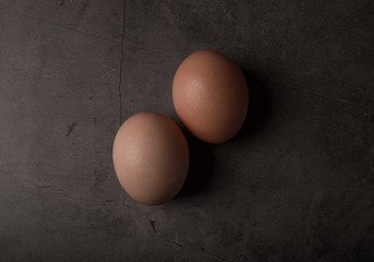 Easter basket with eggs, shot on a dark background