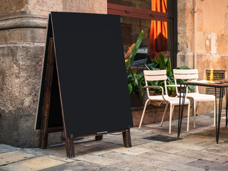 Mock up Menu Signboard Blank chalkboard Restaurant street cafe with table seats