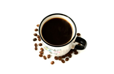 Black coffee in a white ceramic mug and grains on a white background.