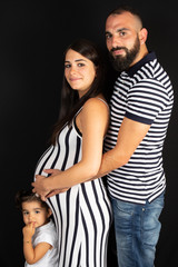 Young pregnant woman with her family father daughter and mother pregnancy