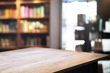 empty wooden table over blurred restaurant background
