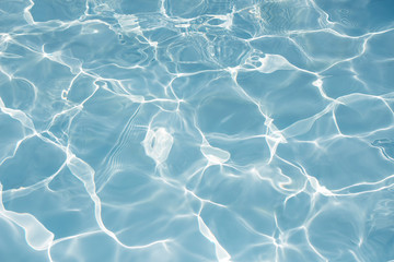 Texture of water in swimming pool for background