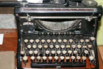 Old vintage rarity printing machine. Typing black.