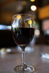 A glass of wine on table in restaurant
