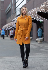 young stylish beautiful woman walking in street, wearing, fashion outfit, autumn trend 
