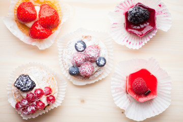 Food concept. Cakes and cup of delicious tea for happy day. Top view. Space for a text.