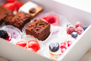 Food concept. Cakes and cup of delicious tea for happy day. Top view. Space for a text.