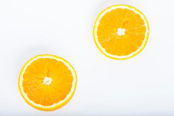 Sliced orange isolated on white. Healthy food, diet and cooking concept.