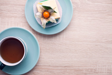 Food concept. Cakes and cup of delicious tea for happy day. Top view. Space for a text.