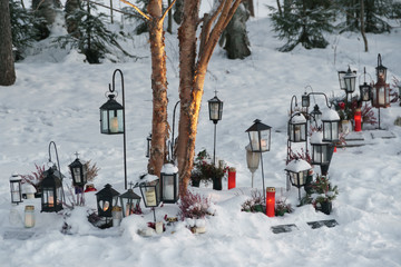 Memorial with lanterns in snowy landscape