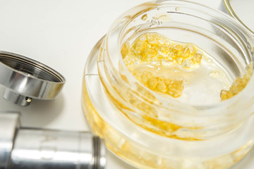 THCA Crystals Next To A Cannabis Extract Vape Pen