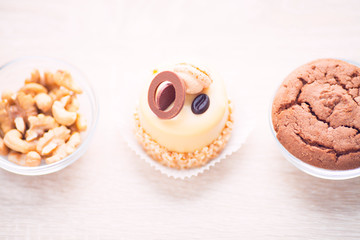 Food concept. Cakes and cup of delicious tea for happy day. Top view. Space for a text.