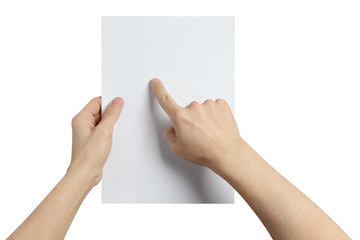 Hands holding and examining a sheet of paper, isolated on white background