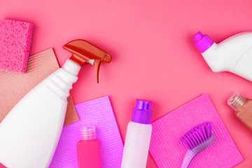 House cleaning products are on pink background.