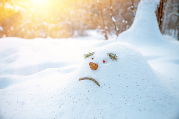 Sad snowdrift, snowman, in anticipation of spring